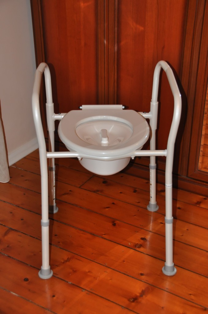 Overtoilet aid folding with splash guard for elderly, seniors, aged
